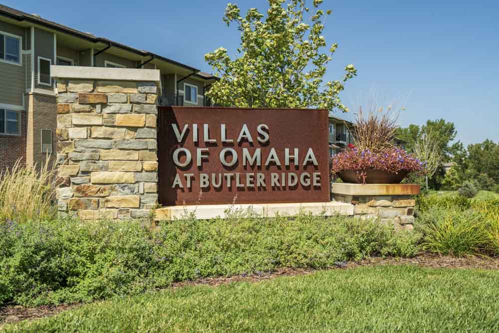 Entrance sign at Villas of Omaha townhome apartments in northwest Omaha NE 68116
