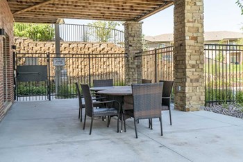 Outdoor seating by pool at Villas of Omaha in northwest Omaha NE 68116 - Photo Gallery 54