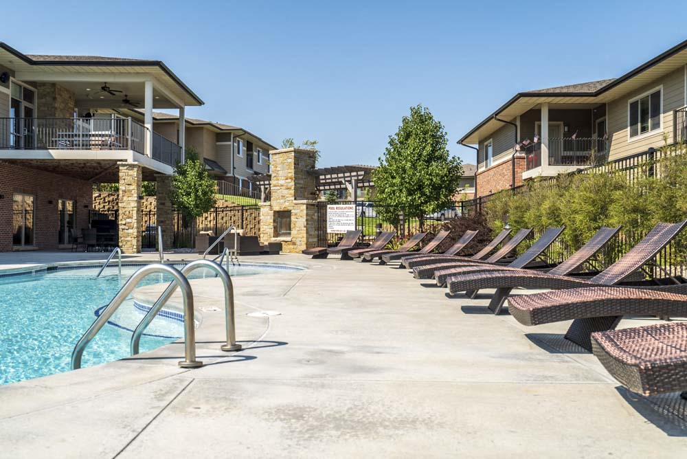 Lounge chairs by the pool at Villas of Omaha in northwest Omaha NE 68116
