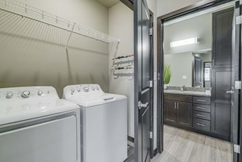 Laundry area and spacious bathroom at WH Flats new luxury apartments in south Lincoln NE 68516
