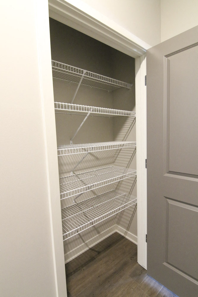 Spacious hallway closet with shelving at WH Flats new luxury apartments in south Lincoln NE 68516