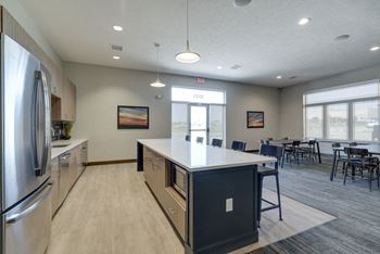 Resident clubhouse with kitchen and seating