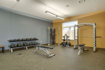 a 24-hour fitness center with weightlifting and cardio equipment