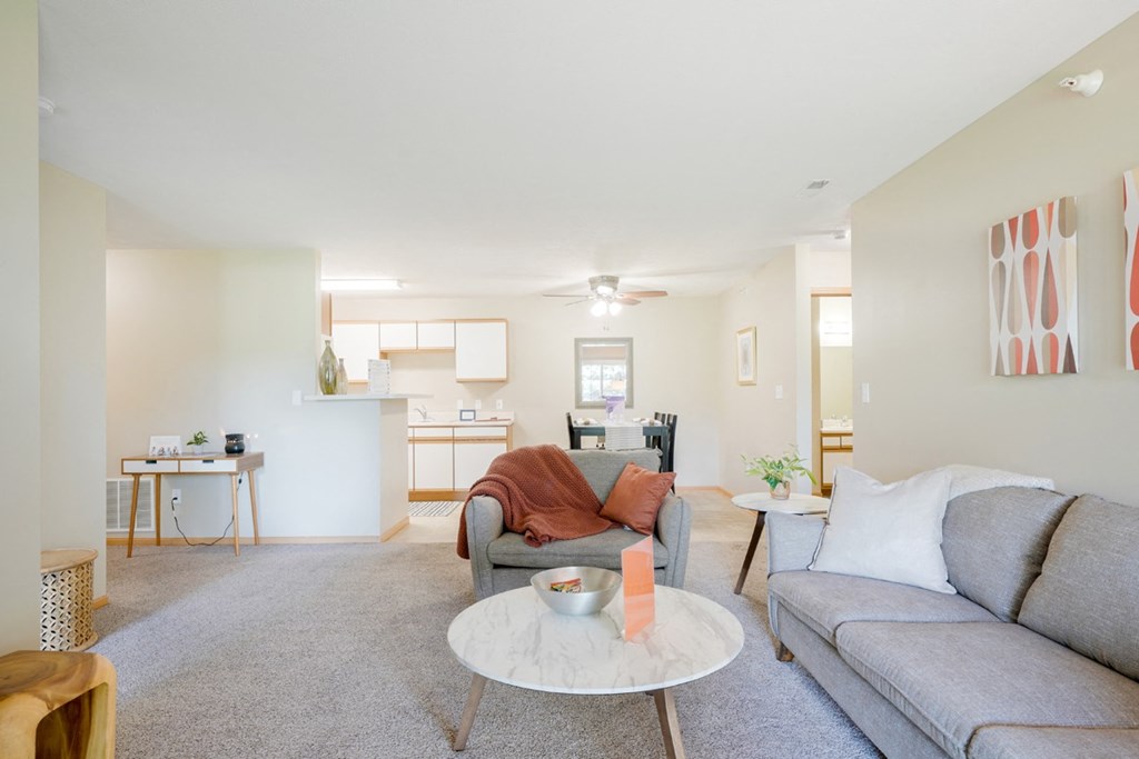 Furnished living room with a couch, a chair, and coffee table