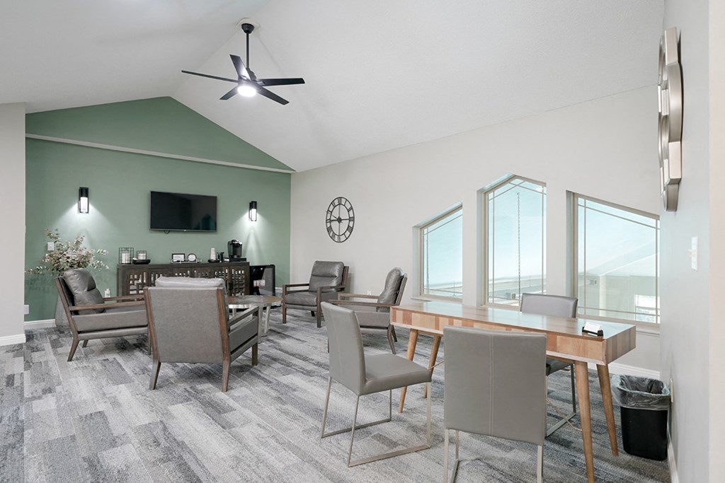 the front office with some chairs and a desk at Southwind Villas clubhouse