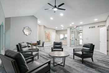 chairs and a table in the waiting area of the front office at Southwind Villas in La Vista, NE