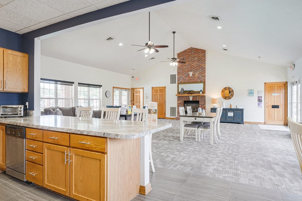 the view from the community kitchen into the living room and dining room of the clubhouse at Williamsburg Park