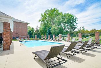 Swimming pool with lounge chairs for sunbathing