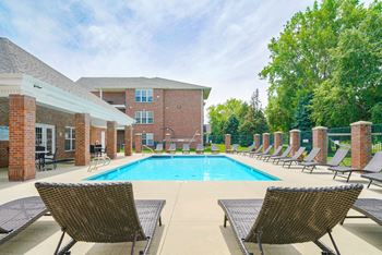 Swimming pool with lounge chairs for sunbathing