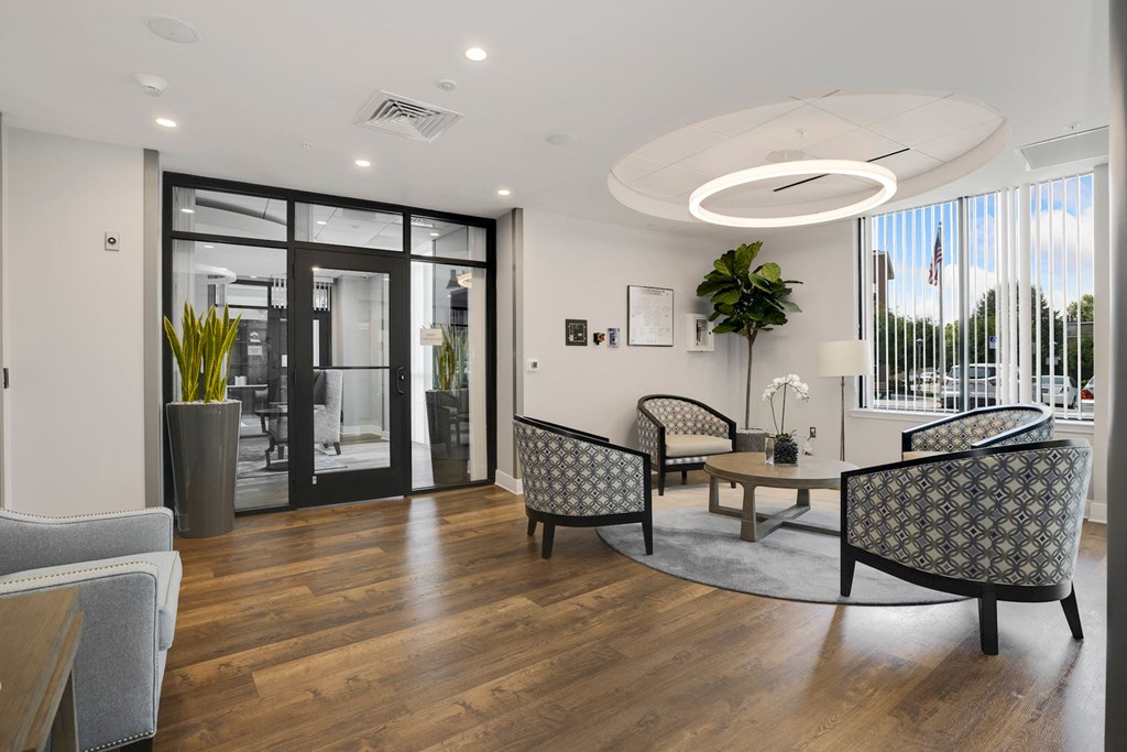 a  lobby area filled with furniture and a large window