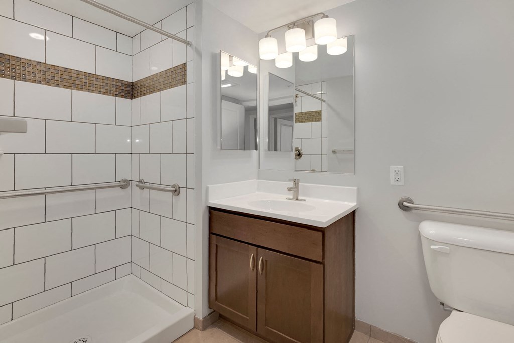 a bathroom with a sink toilet and shower