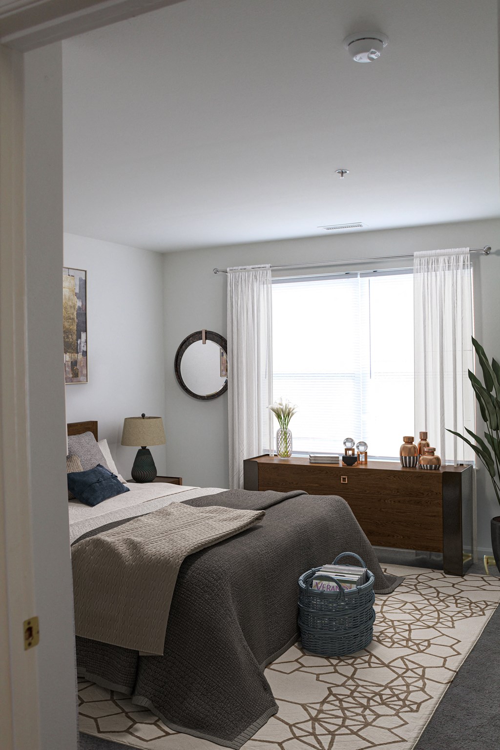 a bedroom with a bed and a dresser