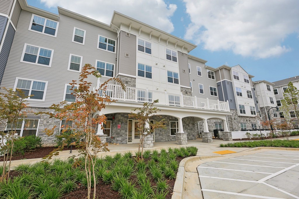 Willow Manor at Cabin Branch – Senior 62+ apartment community exterior in Clarksburg, MD with landscaped grounds and modern architecture