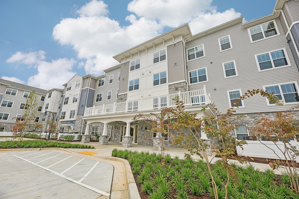 Willow Manor at Cabin Branch – Senior 62+ apartment community exterior in Clarksburg, MD with landscaped grounds and modern architecture