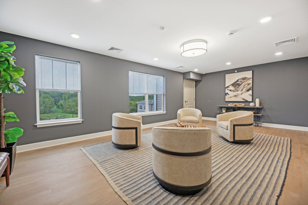 Community lounge at Willow Manor at Cabin Branch – senior living apartments in Clarksburg, MD with comfortable seating and social space