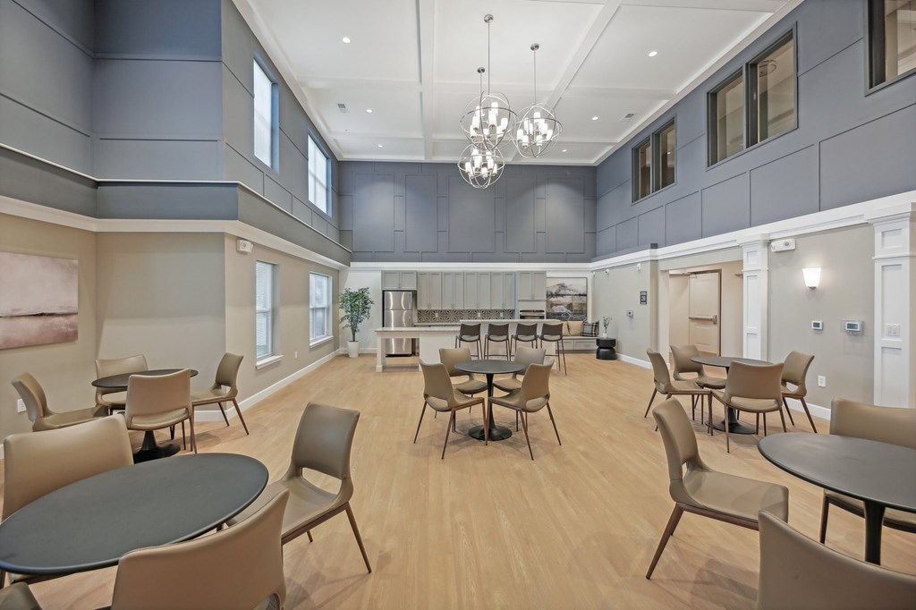 A large room with tables and chairs.