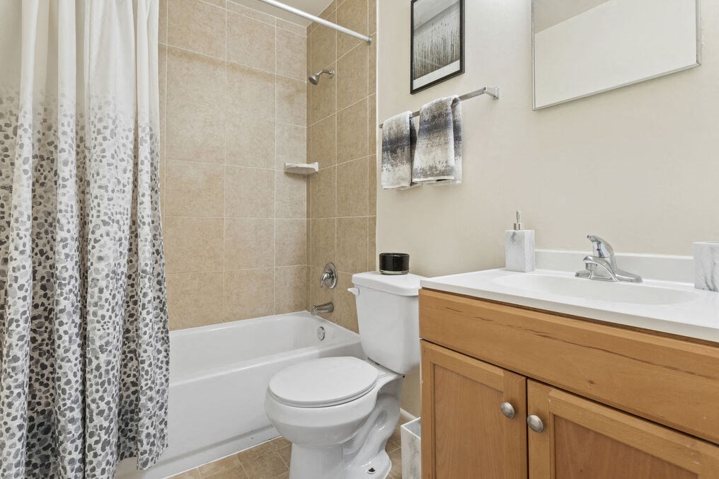 a bathroom with a toilet sink and bathtub
