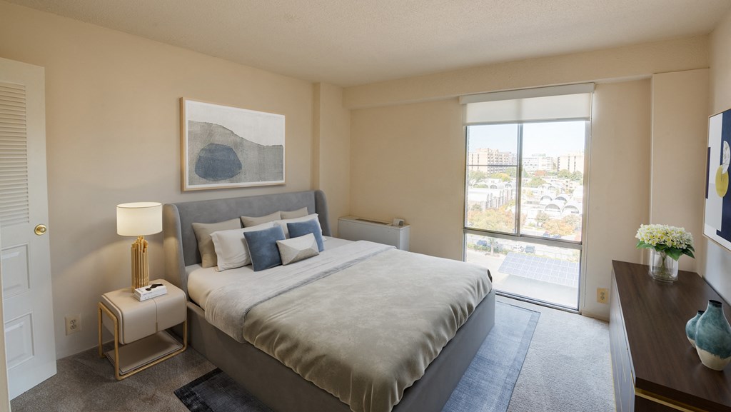 Staged bedroom with spacious closet space and Wharf view