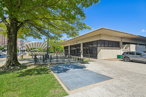 A building with a parking lot in front of it.