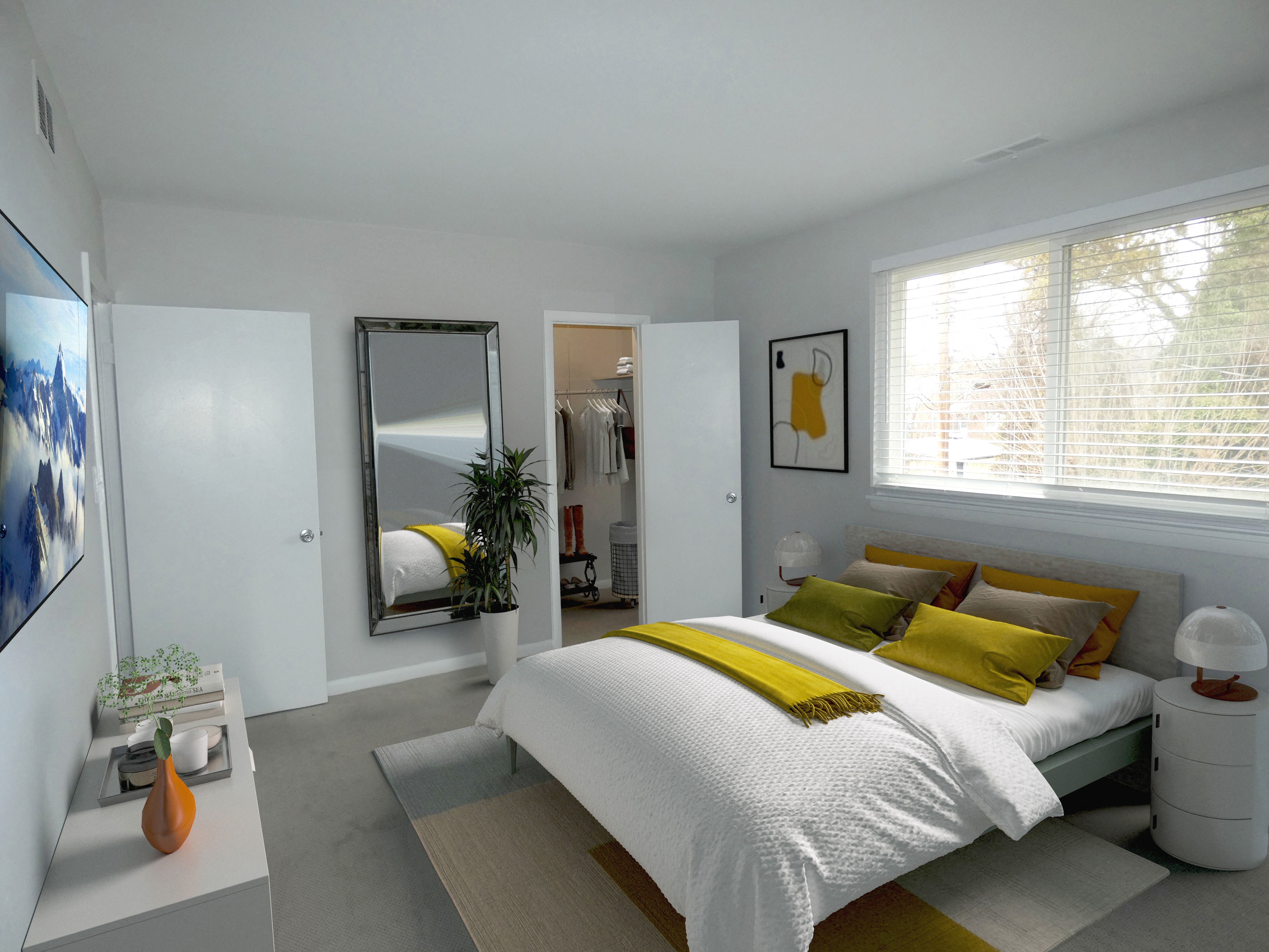a bedroom with white walls and a yellow and white bedspread
