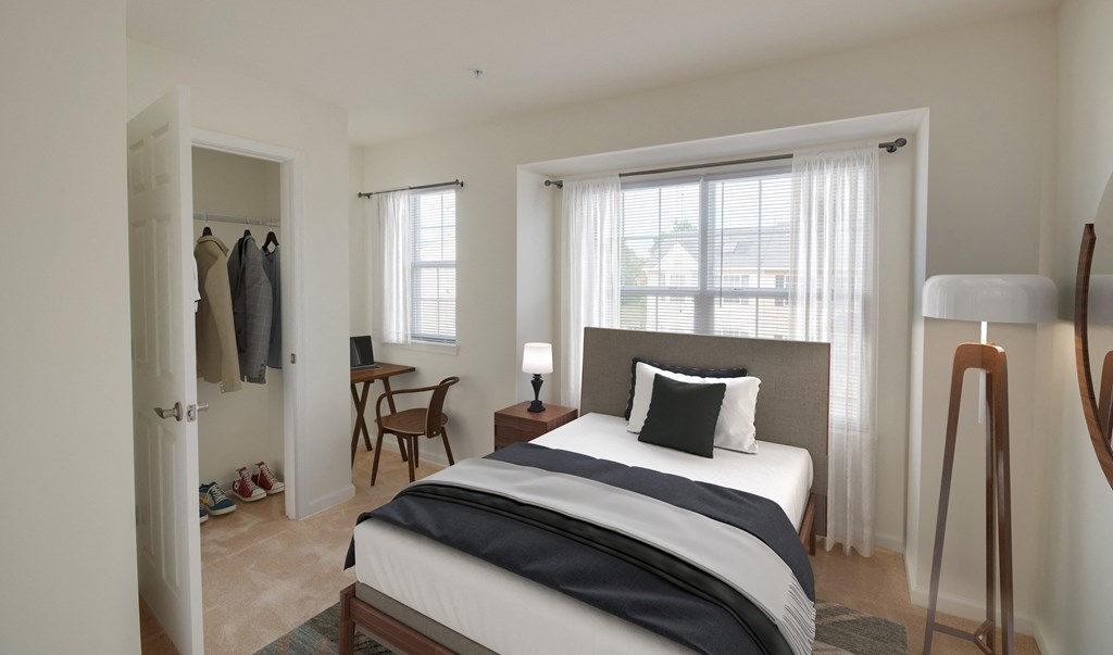 a bedroom with a bed and a closet