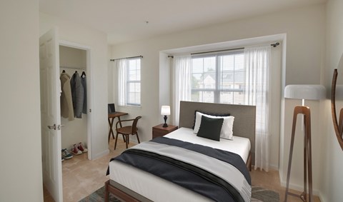 a bedroom with a bed and a closet