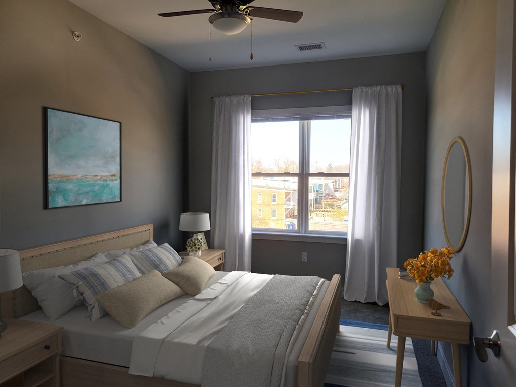 a bedroom with a bed and a ceiling fan