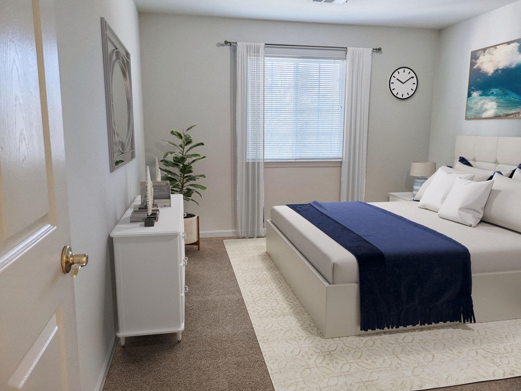 a bedroom with a bed and a clock on the wall