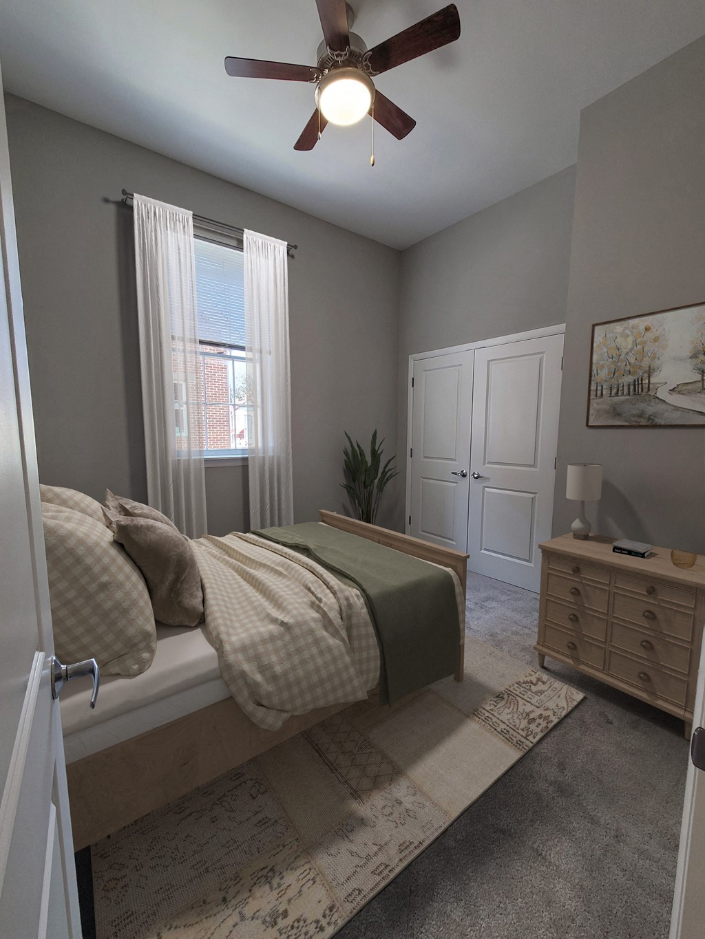 a bedroom with a bed and a ceiling fan