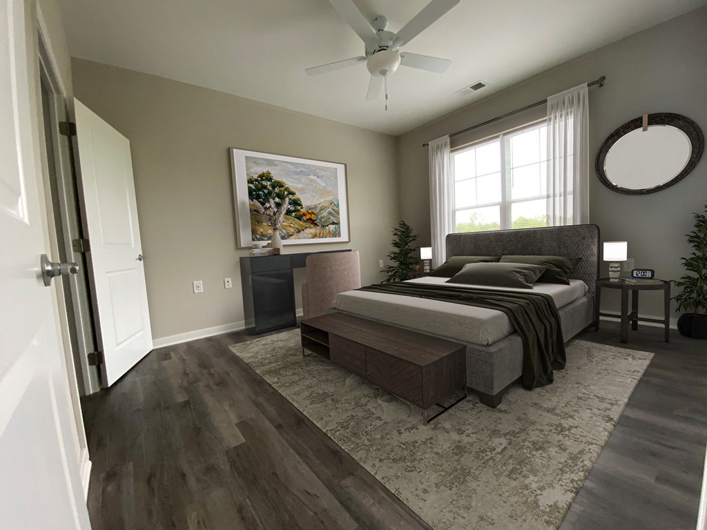 a bedroom with a bed and a ceiling fan