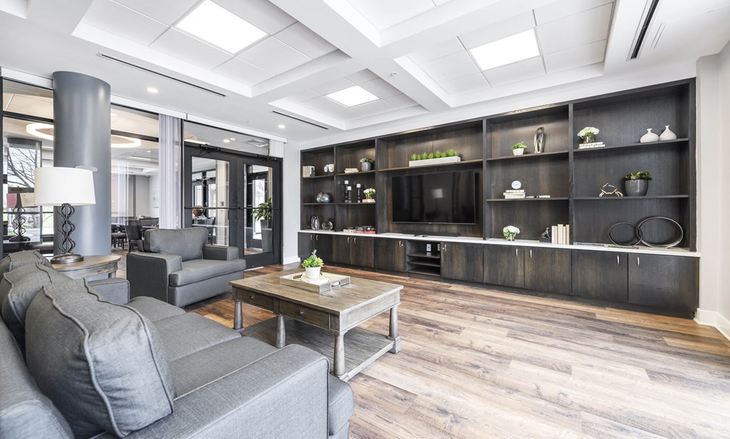 a living room filled with furniture and a large tv