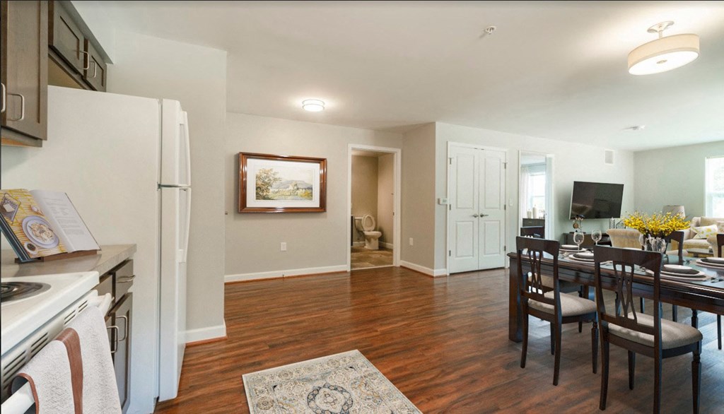 a living room with a kitchen and a dining room
