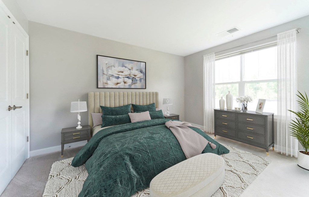 a bedroom with a bed and a dresser and a window