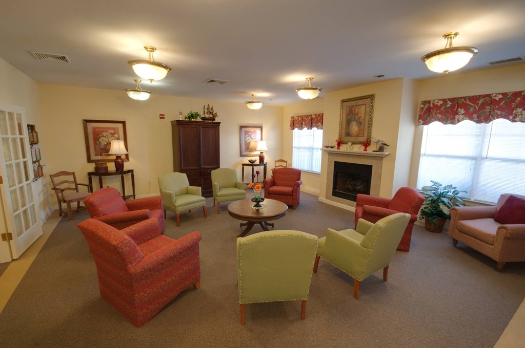 a living room filled with furniture and a fireplace