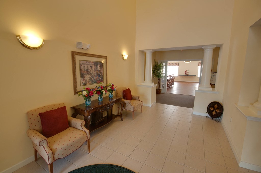 a view of the living room from theoyer of a house