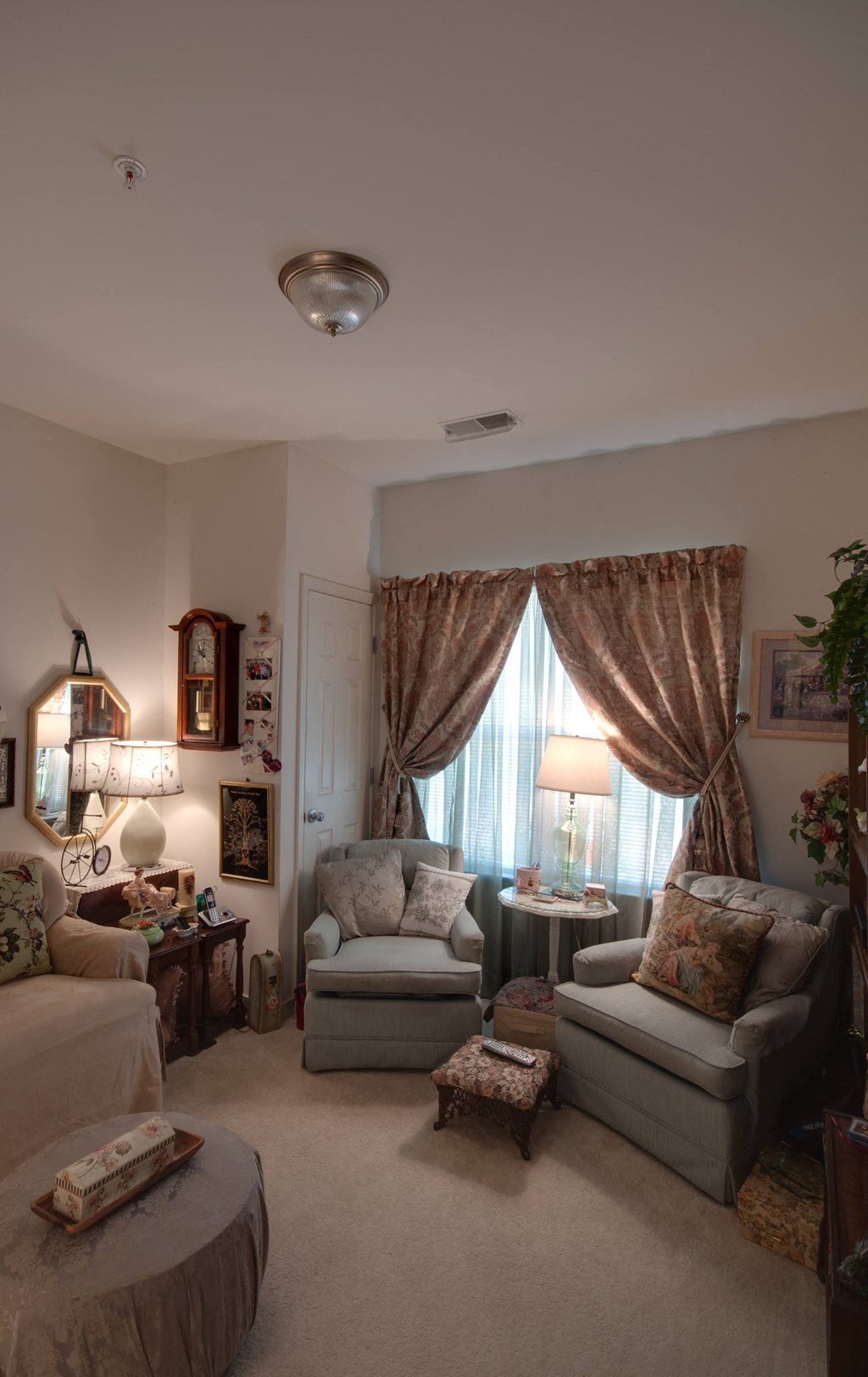 a living room filled with furniture and a large window