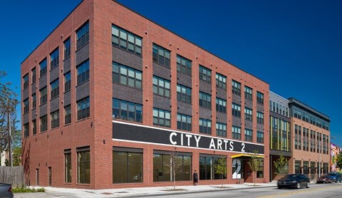 A red brick building with the words "CITY ARTS 2" on the front.