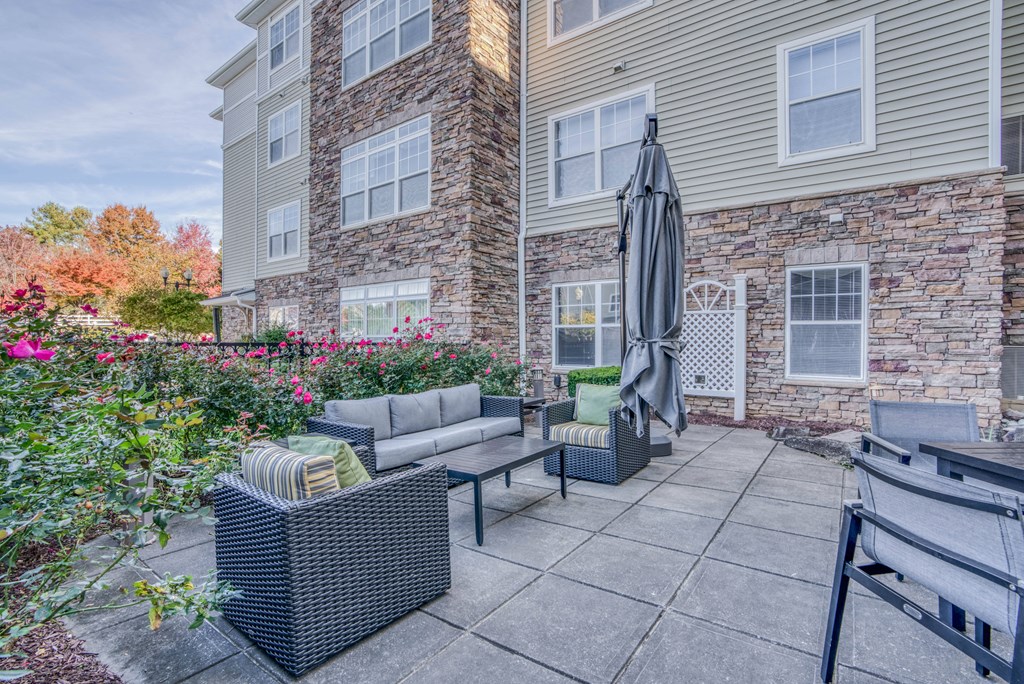 our apartments offer a patio with furniture and an umbrella