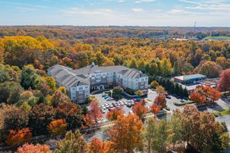 an aerial view of an apartment building in the fall