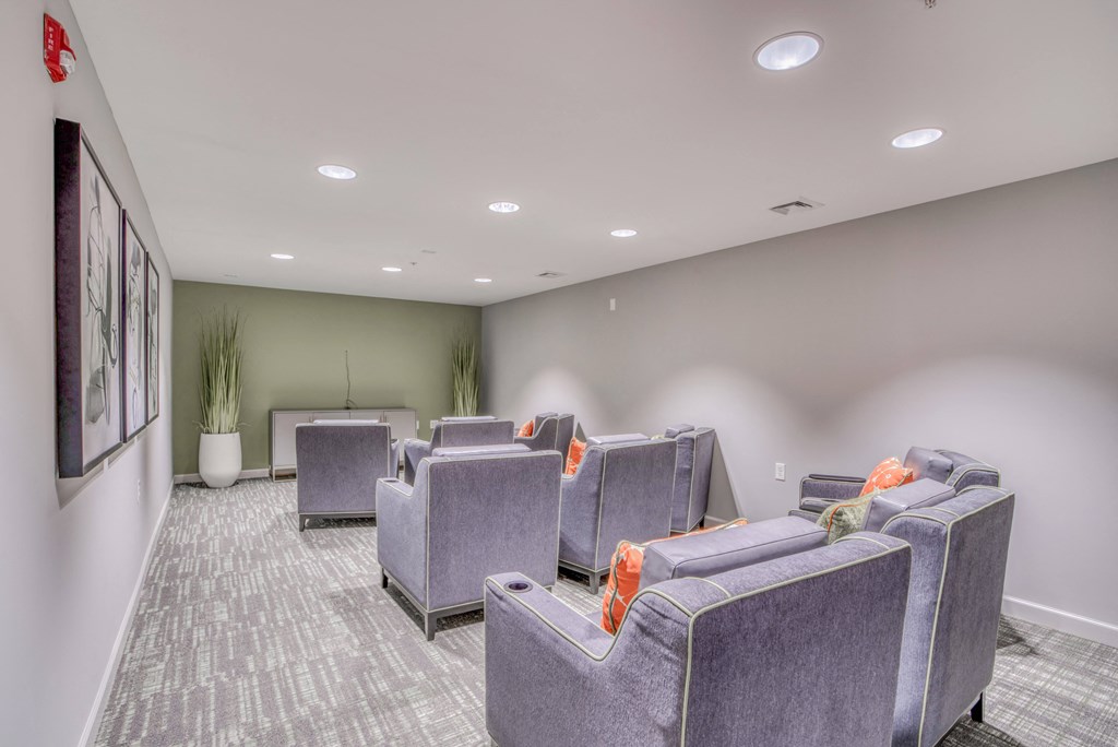 a large room with couches and chairs in it