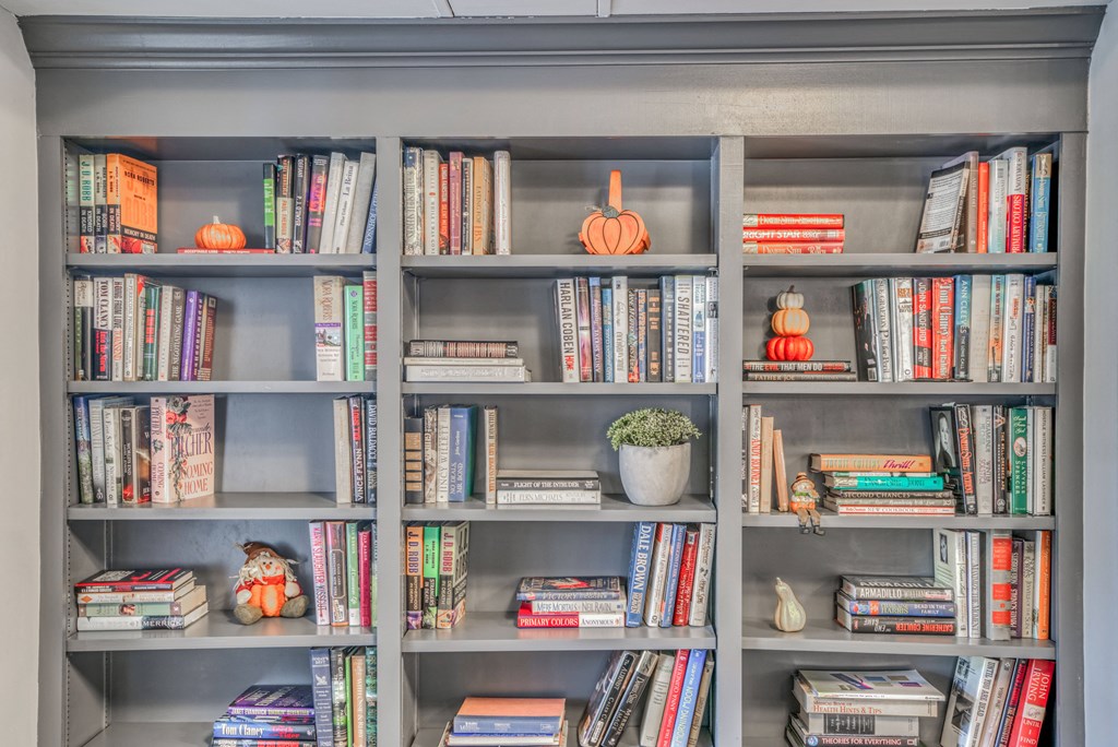 a bookcase filled with books and bookshelves full of books
