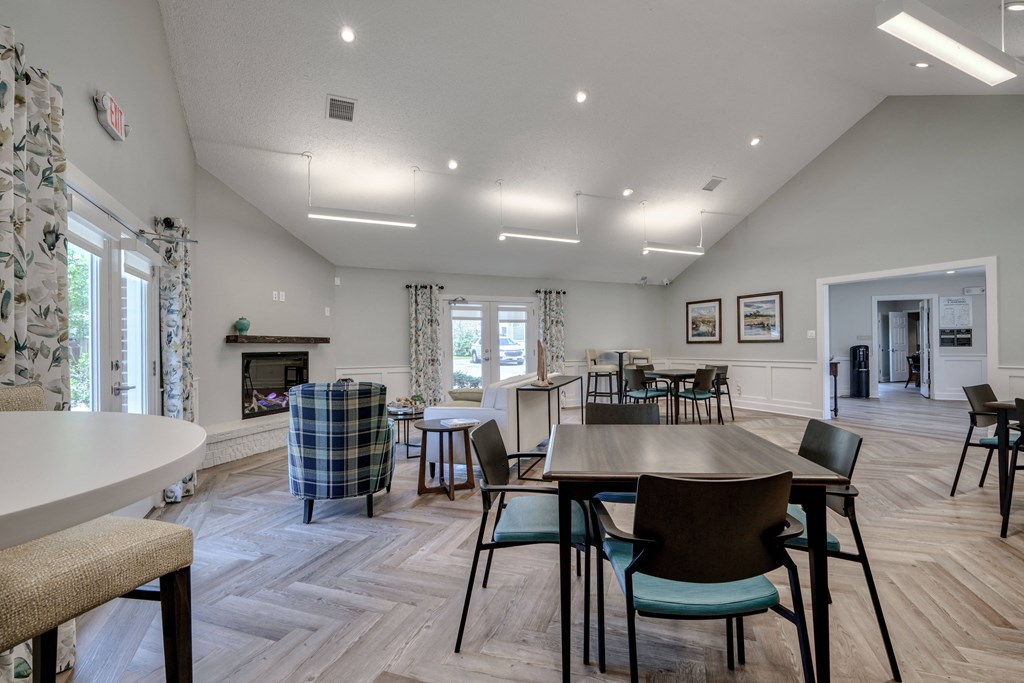 the dining room and living room of a home with a large table and chairs