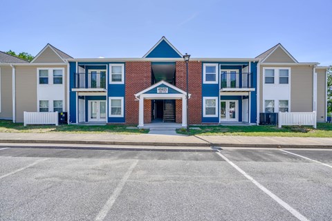 a building with a parking lot in front of it