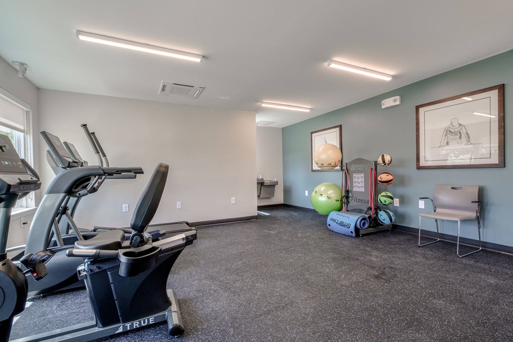 gym with exercise equipment at the district flats apartments in lenexa