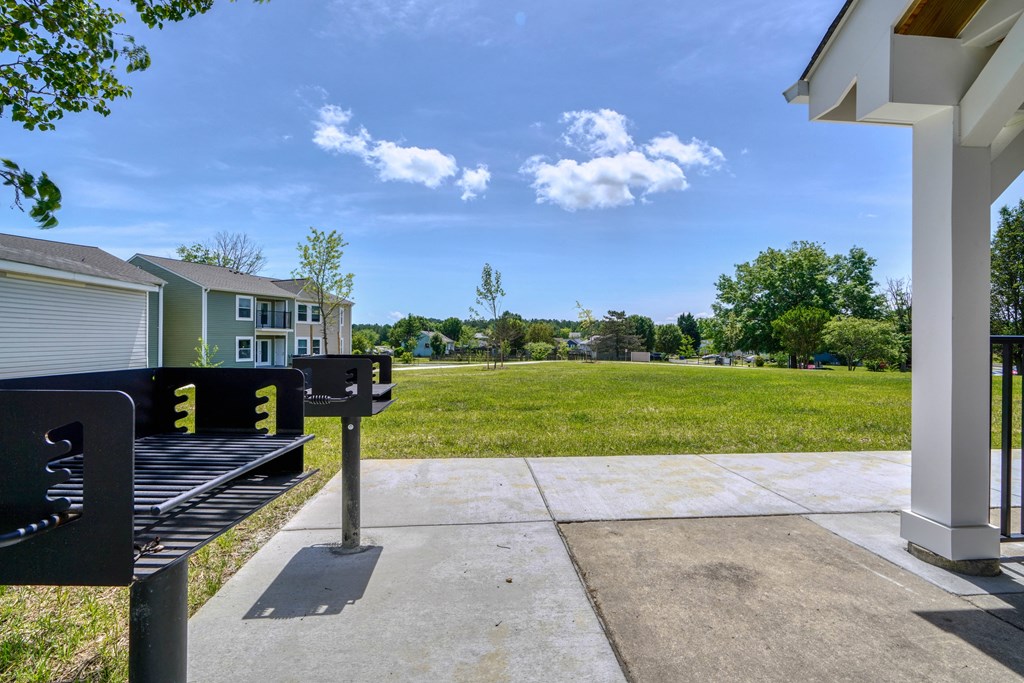 the preserve at ballantyne commons community park bench with grass field and houses