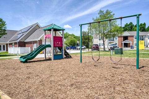 the preserve at ballantyne commons playground with play equipment and houses