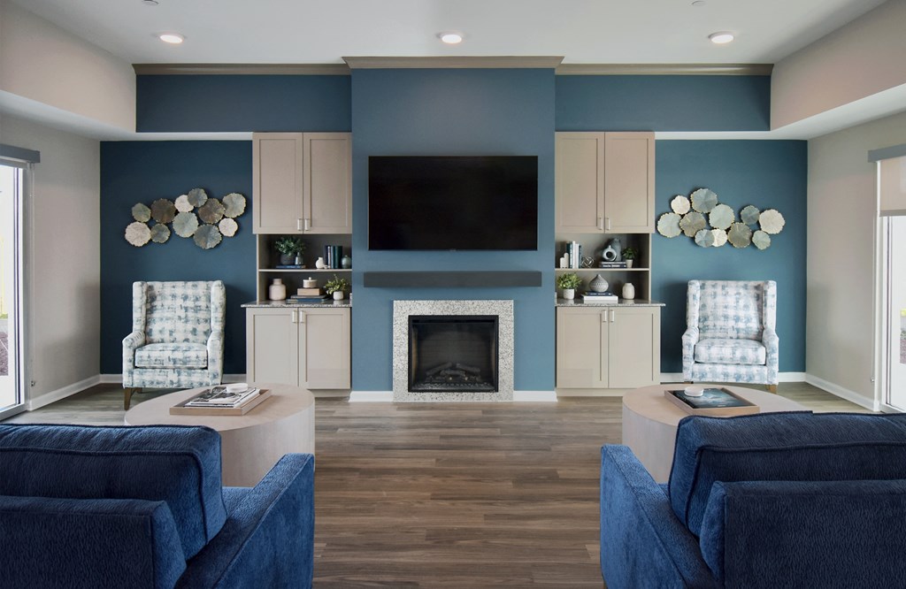 a living room with blue walls and a fireplace