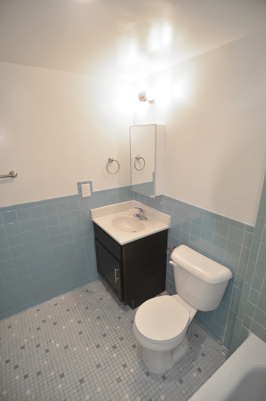 a bathroom with a toilet sink and bathtub
