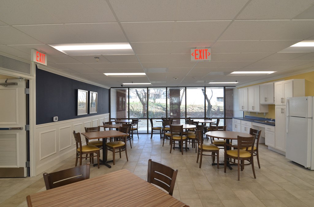 a common area with tables and chairs