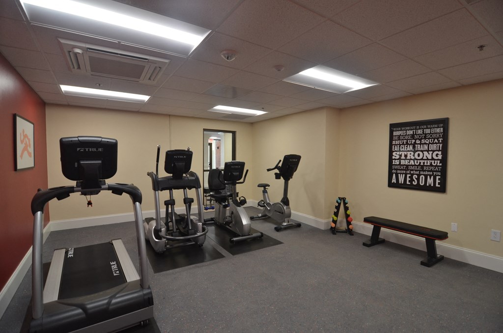 a room filled with lots of exercise equipment